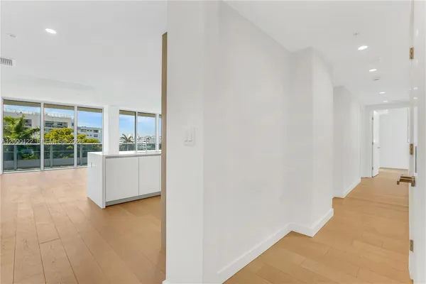 a view of a balcony with swimming pool and furniture