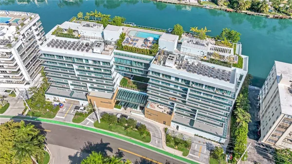 a living room with furniture large window and flat screen tv
