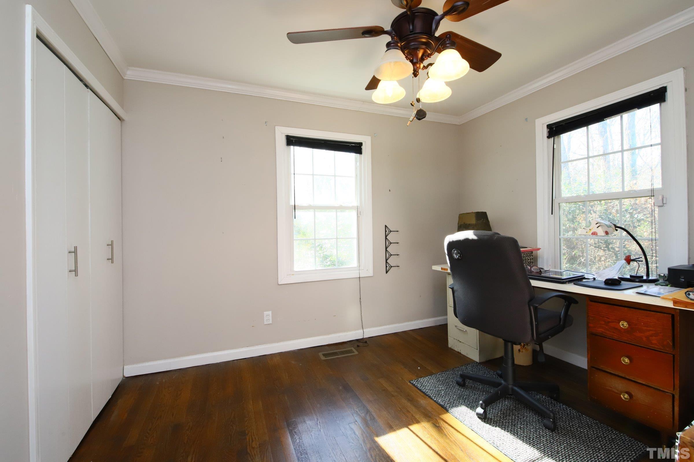 608 Parnell Drive Raleigh, NC 27610 - Photo 22 of 25 a view of a workspace with furniture and a window
