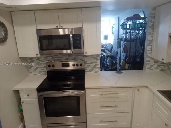 a kitchen with a stove and a microwave