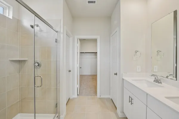 a bathroom with a shower and a sink