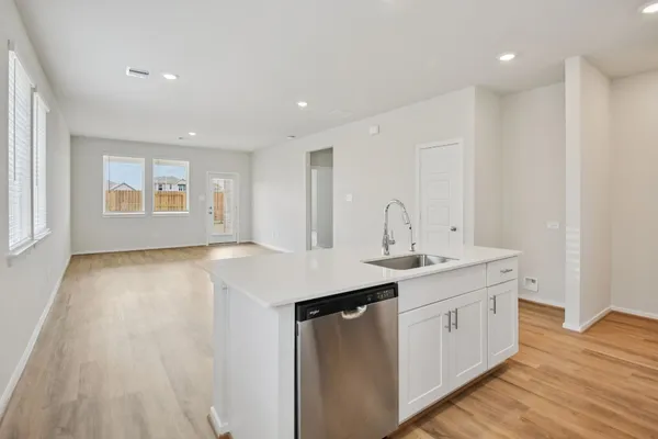 a kitchen with a sink and window