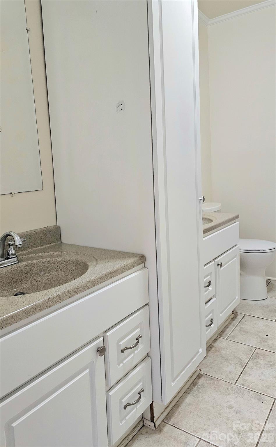 107 Oakgrove Street Locust, NC 28097 - Photo 19 of 32 a bathroom with a sink and a mirror