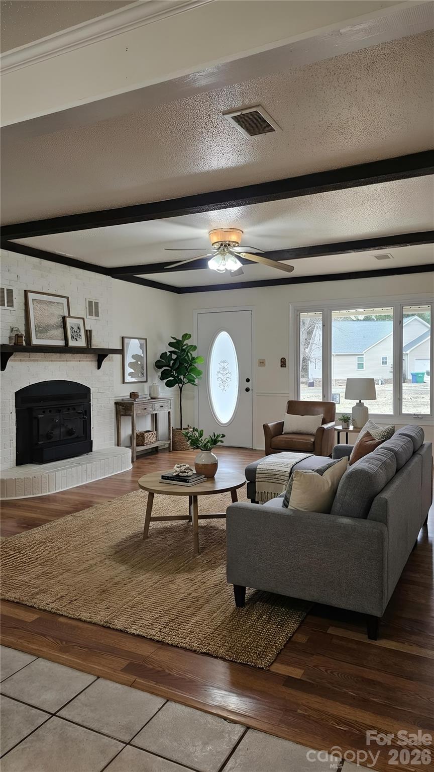 107 Oakgrove Street Locust, NC 28097 - Photo 27 of 32 a living room with furniture and a fireplace