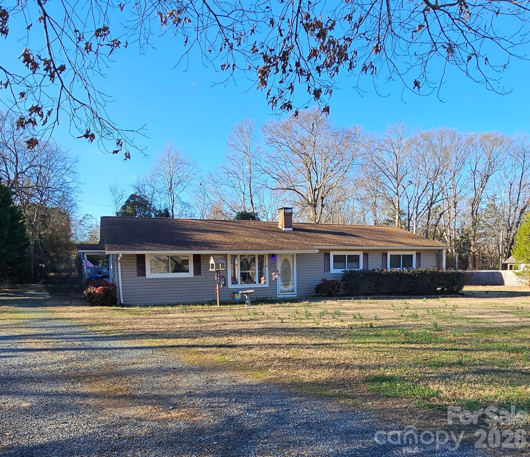 107 Oakgrove Street Locust, NC 28097 - Photo 3 of 32 a front view of a house with a yard