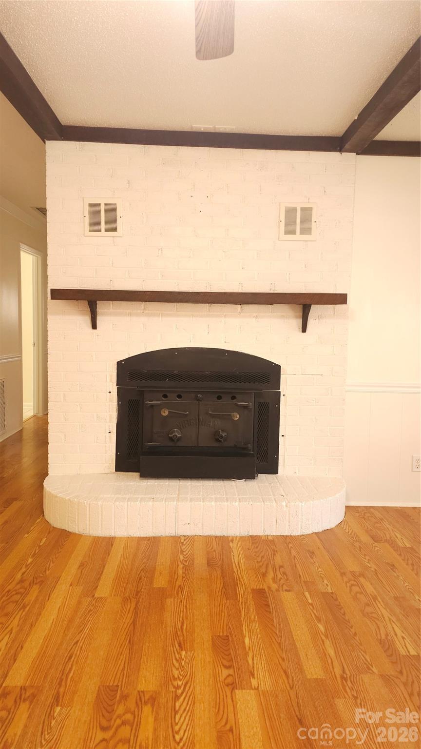 107 Oakgrove Street Locust, NC 28097 - Photo 6 of 32 a living room with a bed