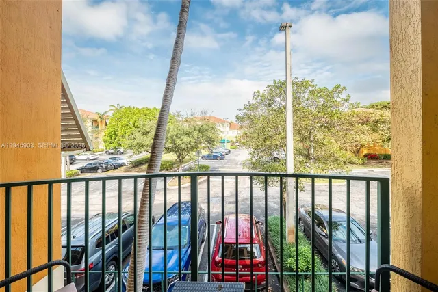 a kitchen with stainless steel appliances a refrigerator sink and white cabinets
