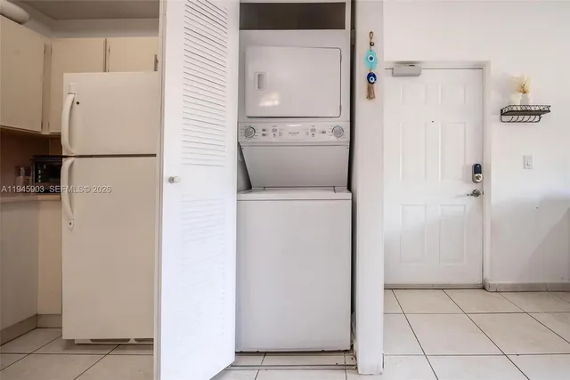 a living room with furniture and flowers