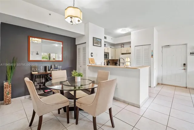 a kitchen with a dining table and chairs