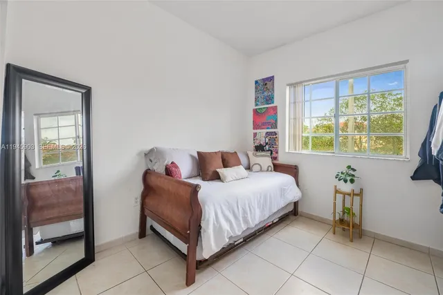 a bed room with a bed and a window