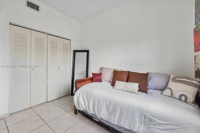 a white toilet sitting next to a shower curtain