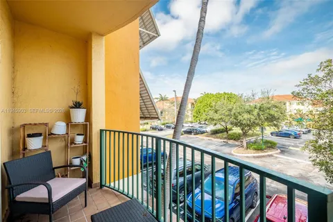 a view of a balcony with furniture