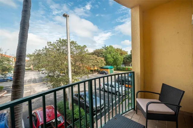 a view of a balcony with furniture