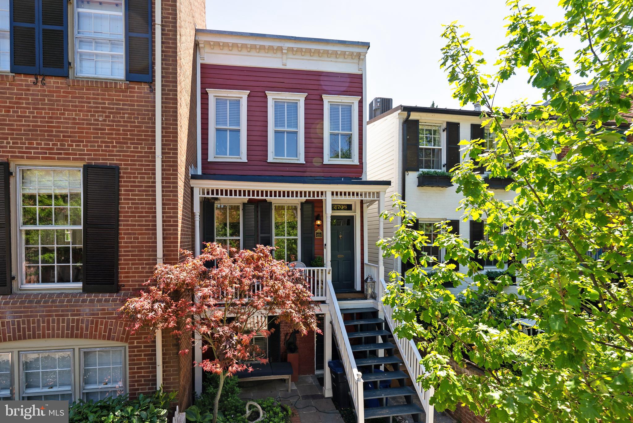 2708 O Street Northwest Washington, DC 20007 - Photo 6 of 12 front view of a brick house with a yard
