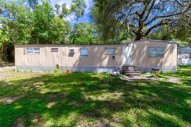 a backyard of a house with lots of green space