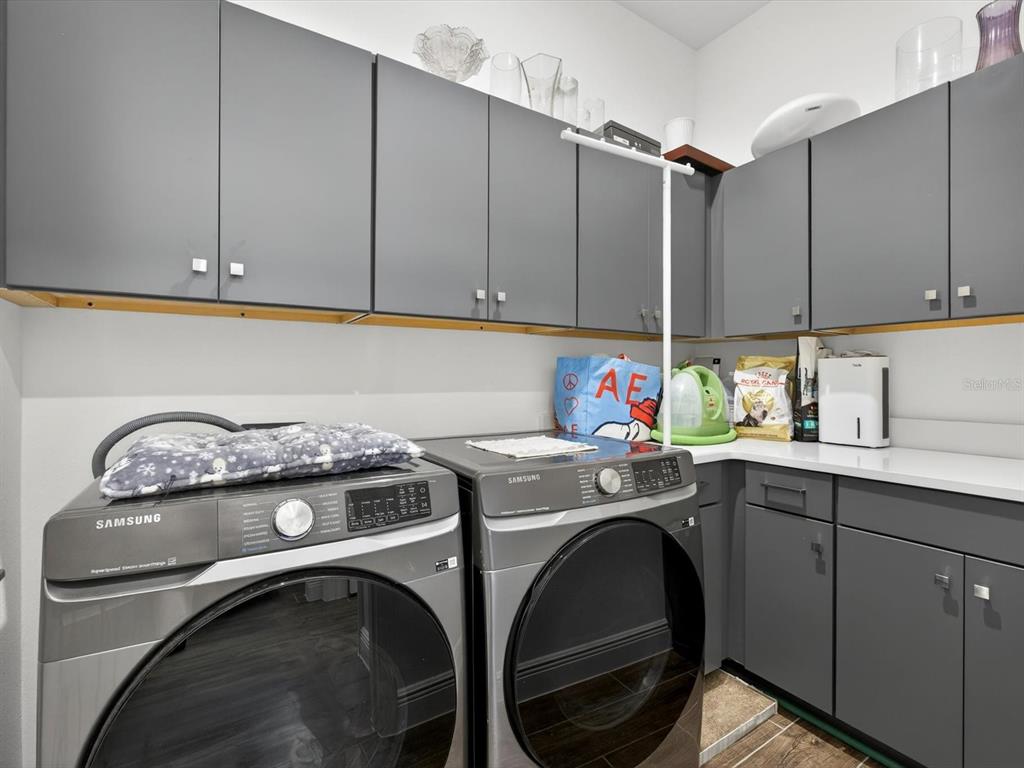 9952 Rodbell Street Orlando, FL 32827 - Photo 13 of 44 a utility room with dryer and washer