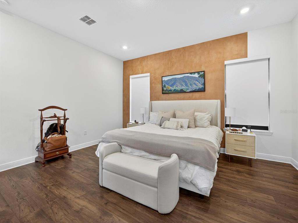 9952 Rodbell Street Orlando, FL 32827 - Photo 15 of 44 a bedroom with a bed and a couch