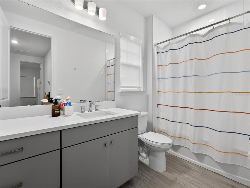 9952 Rodbell Street Orlando, FL 32827 - Photo 28 of 44 a bathroom with a sink toilet and shower