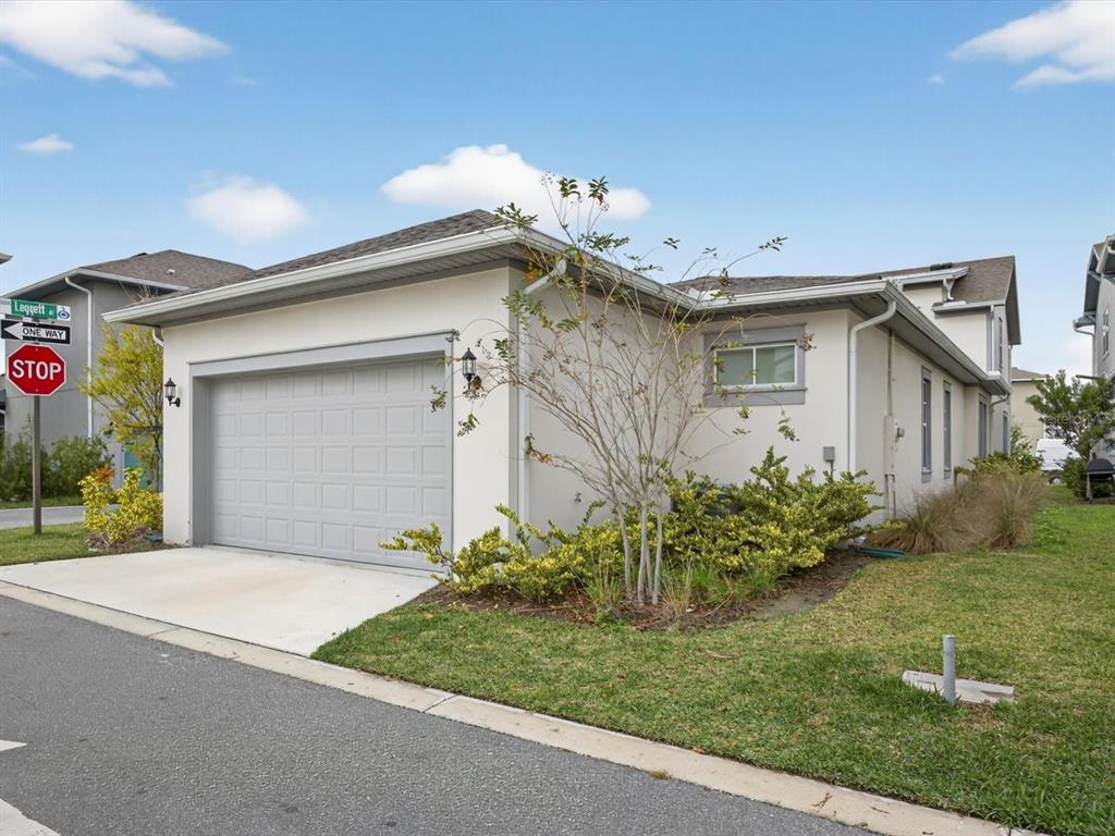 9952 Rodbell Street Orlando, FL 32827 - Photo 33 of 44 a front view of a house with garden
