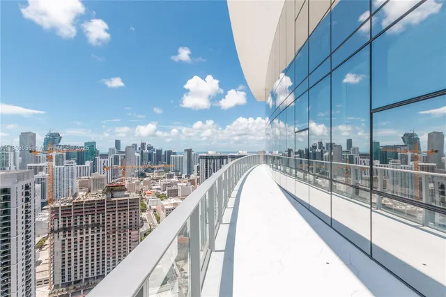 a view of a room with furniture and a fireplace