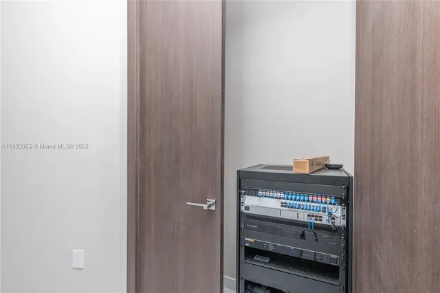 a bedroom with a large bed and a large window