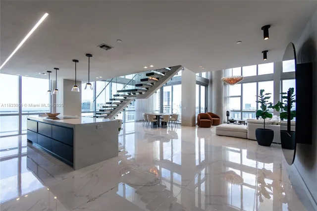 a view of a living room and kitchen