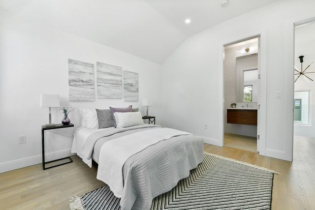 a bedroom with a bed and dresser