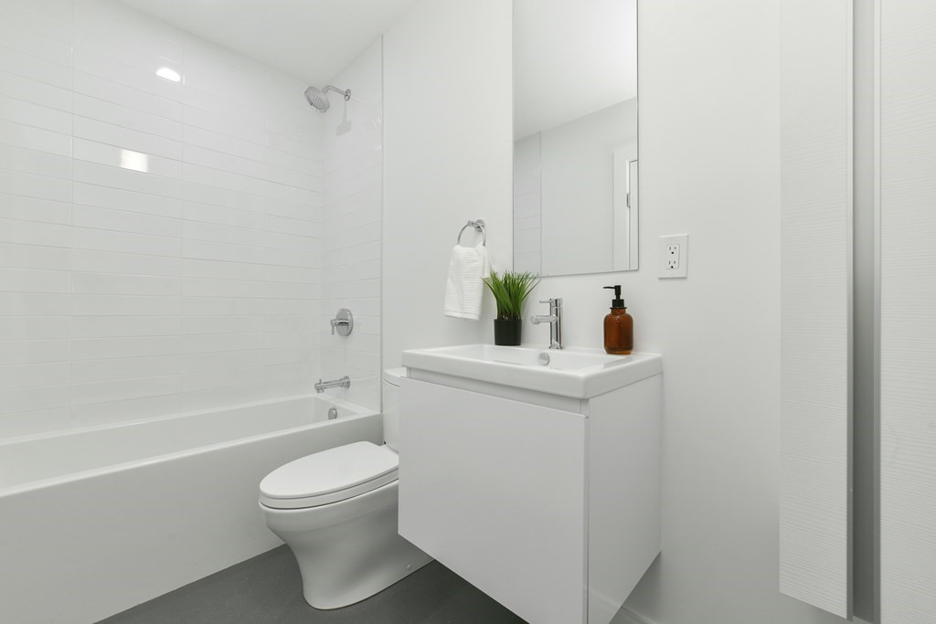 63 Alpine Street, Unit 1 Cambridge, MA 02138 - Photo 21 of 27 a bathroom with a sink a toilet and shower