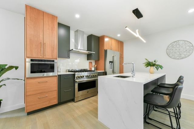 a kitchen with a table and chairs