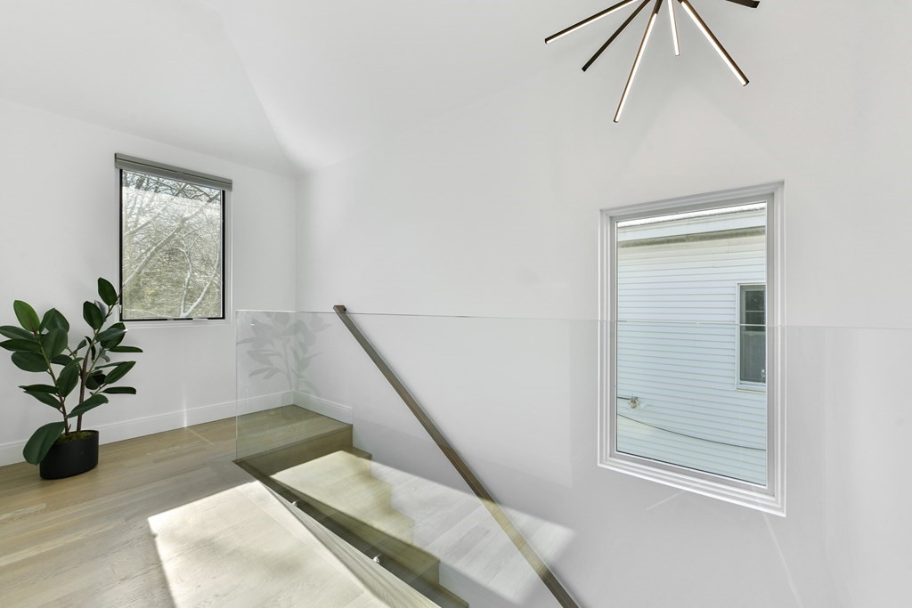 63 Alpine Street, Unit 1 Cambridge, MA 02138 - Photo 9 of 27 a view of entryway and hall with wooden floor