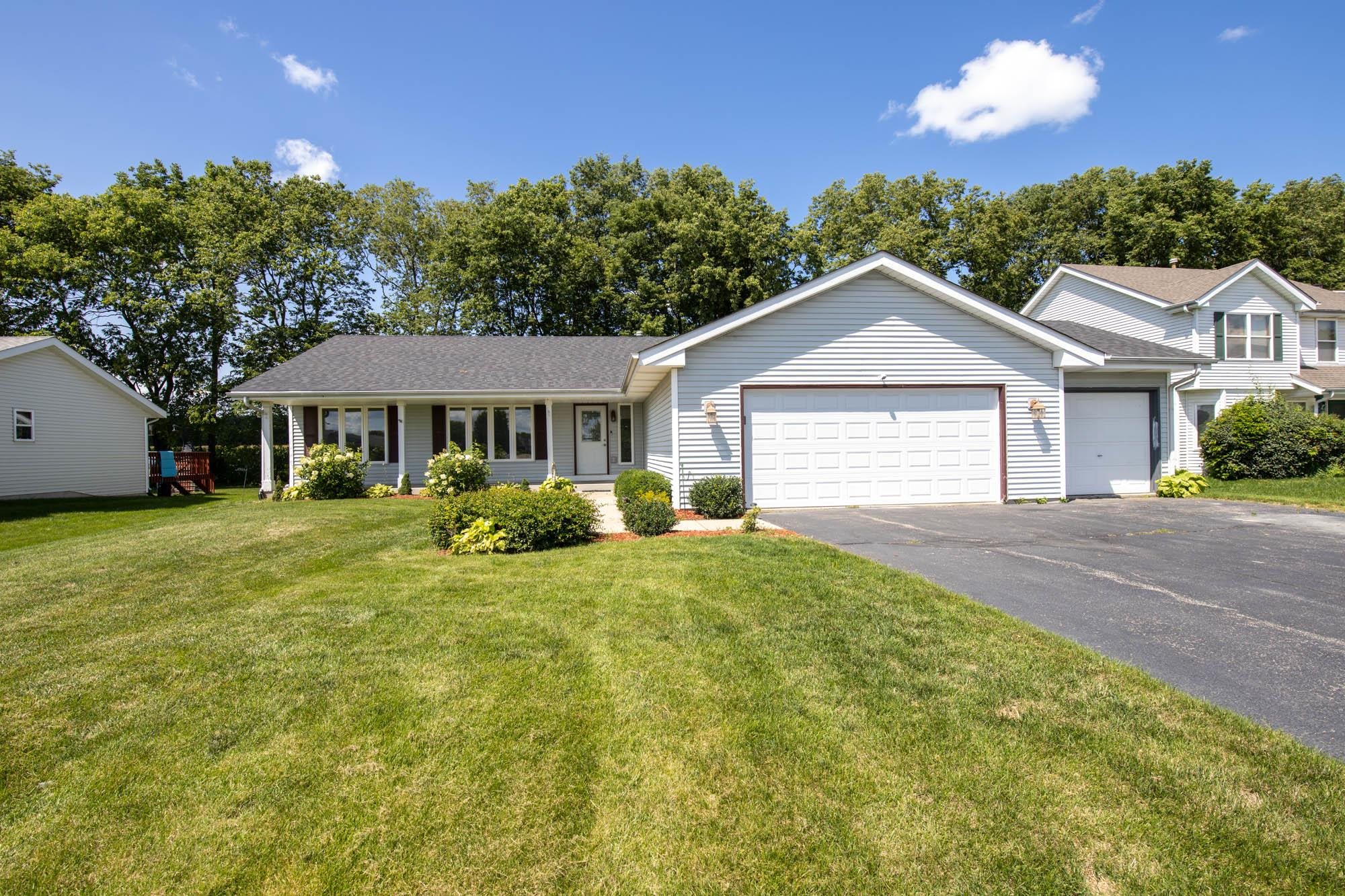 10686 Meadowsweet Lane Roscoe, IL 61073 - Photo 1 of 33 a view of an house with backyard space and balcony