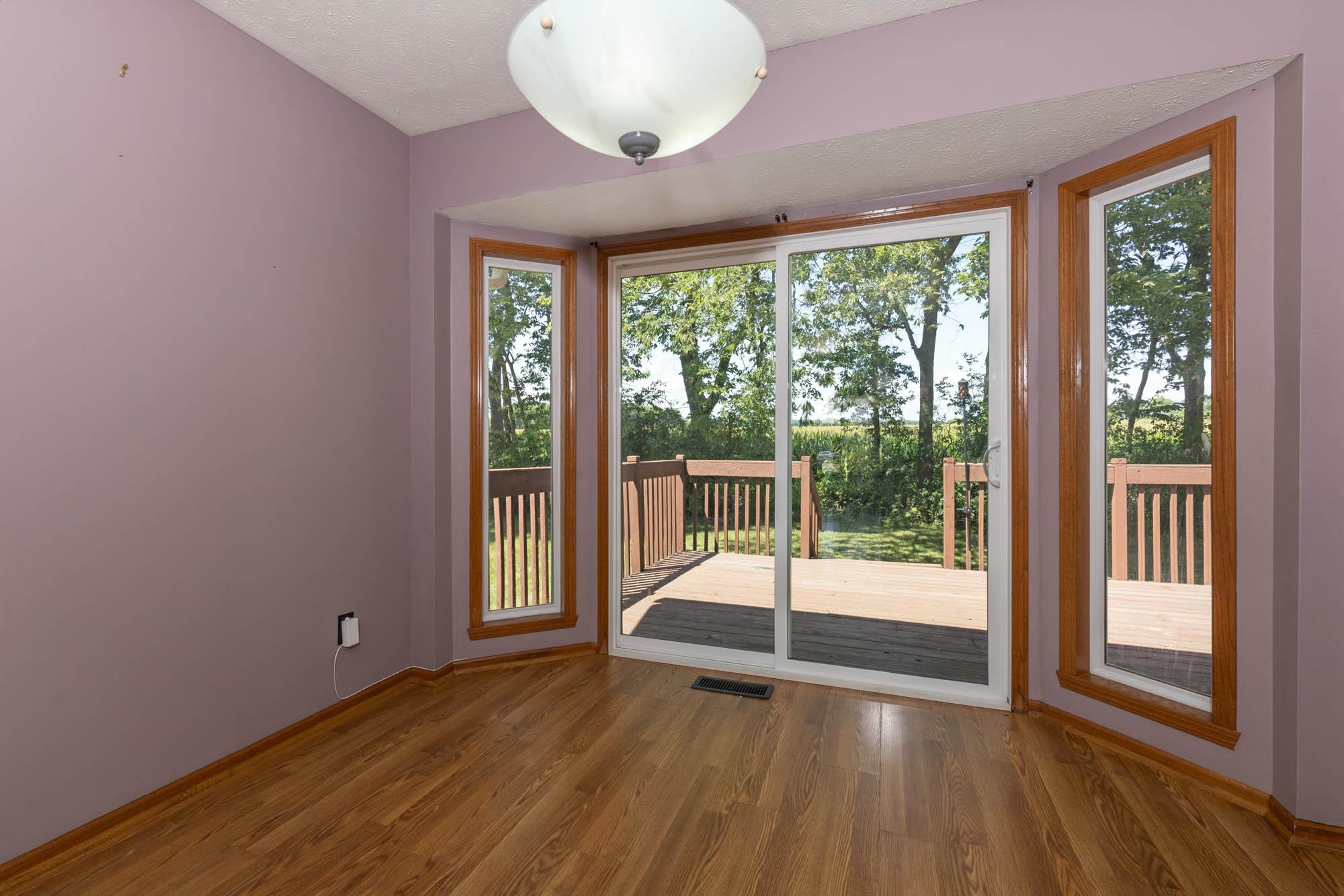 10686 Meadowsweet Lane Roscoe, IL 61073 - Photo 13 of 33 a view of a room with wooden floor and front door