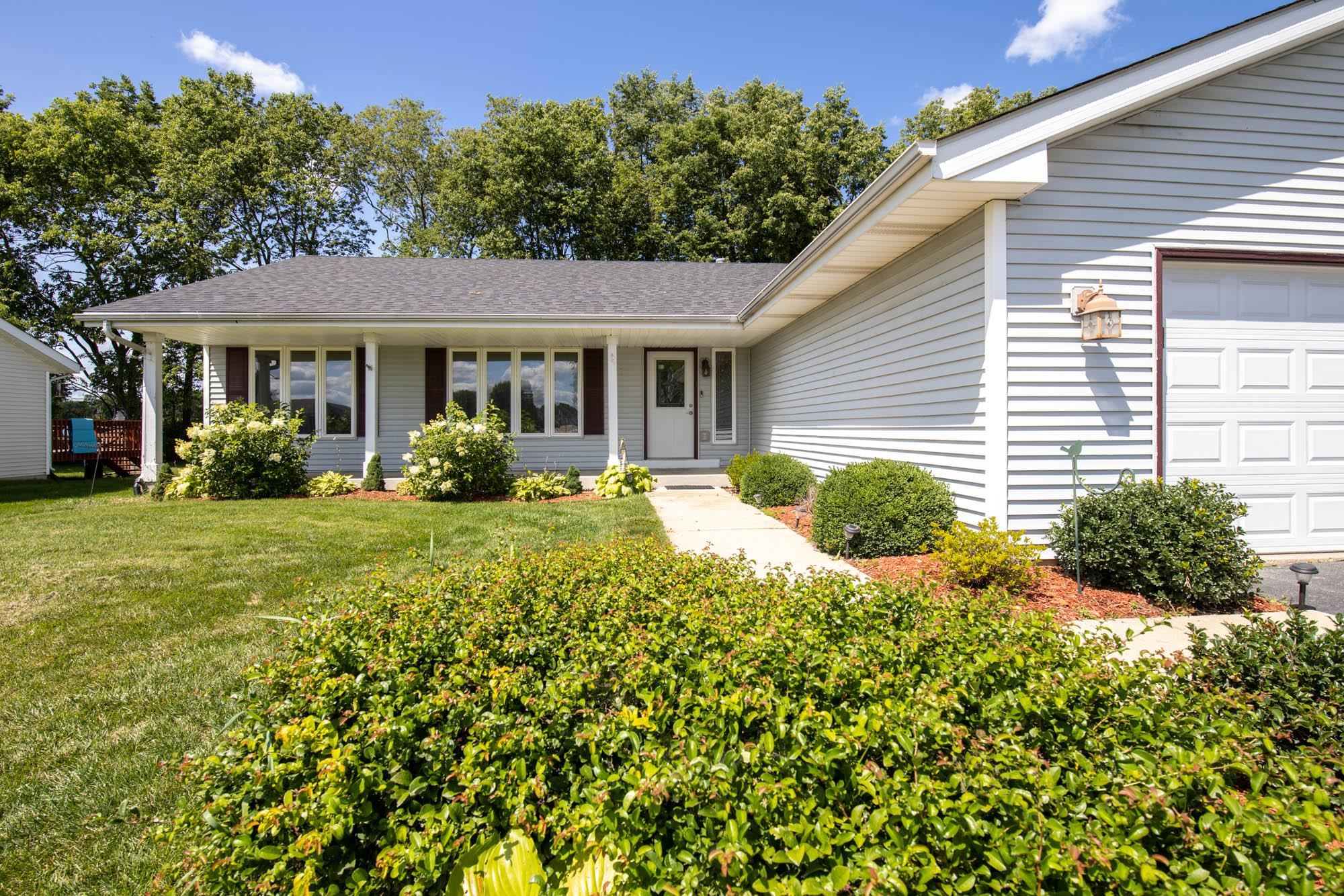 10686 Meadowsweet Lane Roscoe, IL 61073 - Photo 2 of 33 a view of a house with a garden