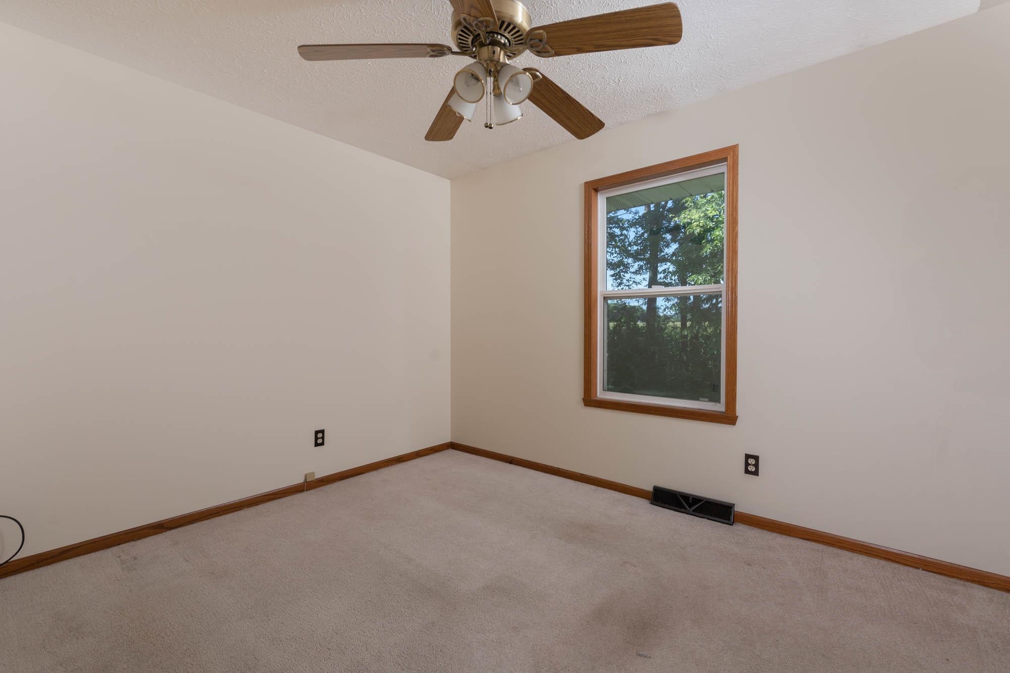 10686 Meadowsweet Lane Roscoe, IL 61073 - Photo 24 of 33 a view of an empty room with a window