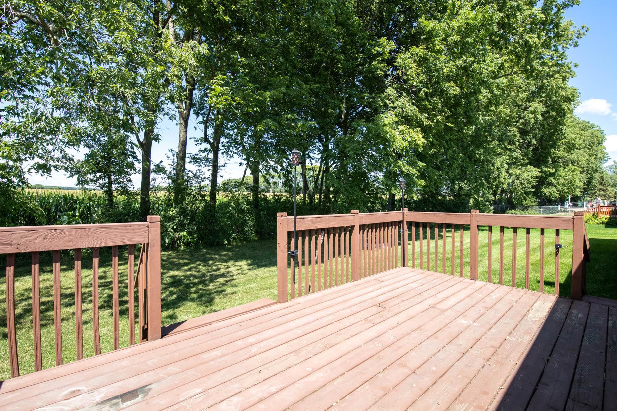 10686 Meadowsweet Lane Roscoe, IL 61073 - Photo 31 of 33 a balcony with wooden floor and fence