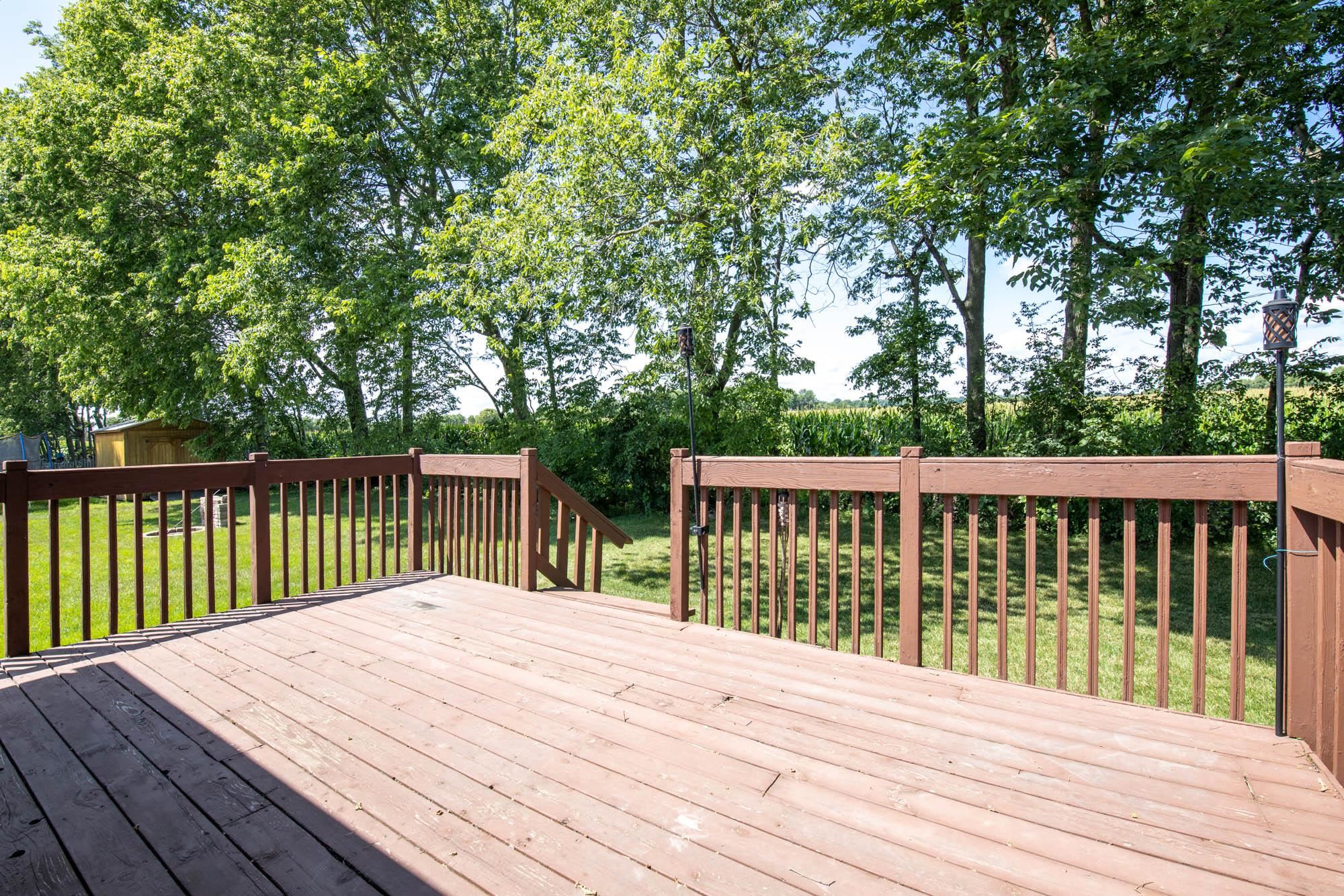 10686 Meadowsweet Lane Roscoe, IL 61073 - Photo 32 of 33 a view of a wooden roof deck