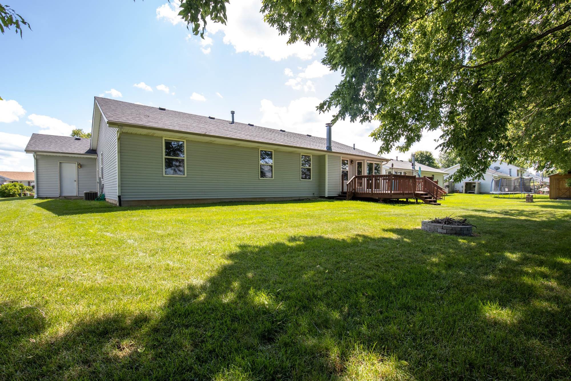 10686 Meadowsweet Lane Roscoe, IL 61073 - Photo 33 of 33 a view of a house with a big yard