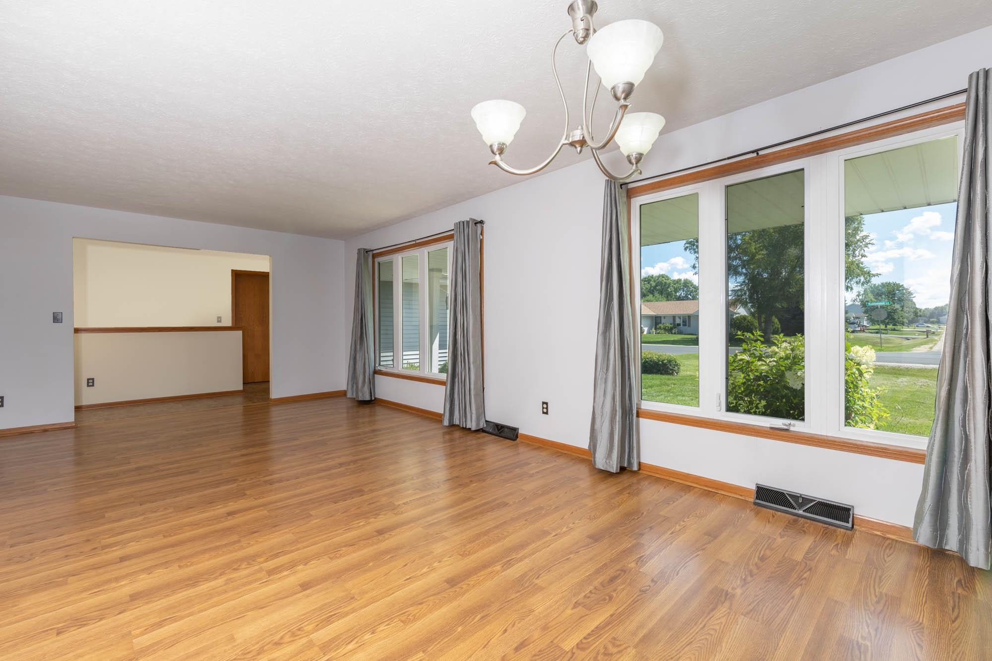 10686 Meadowsweet Lane Roscoe, IL 61073 - Photo 4 of 33 a view of empty room with wooden floor and fan
