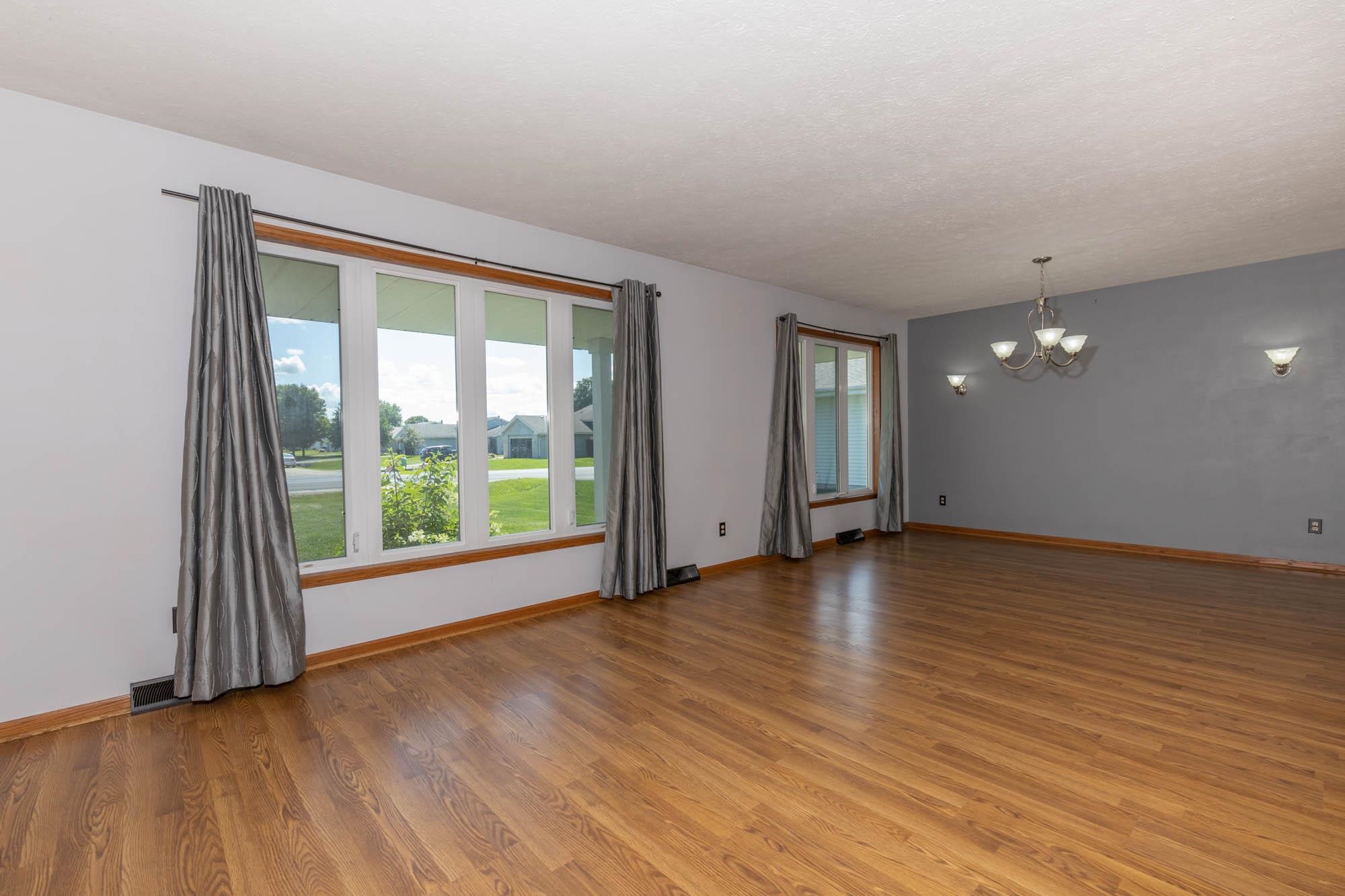 10686 Meadowsweet Lane Roscoe, IL 61073 - Photo 5 of 33 a view of empty room with wooden floor and fan