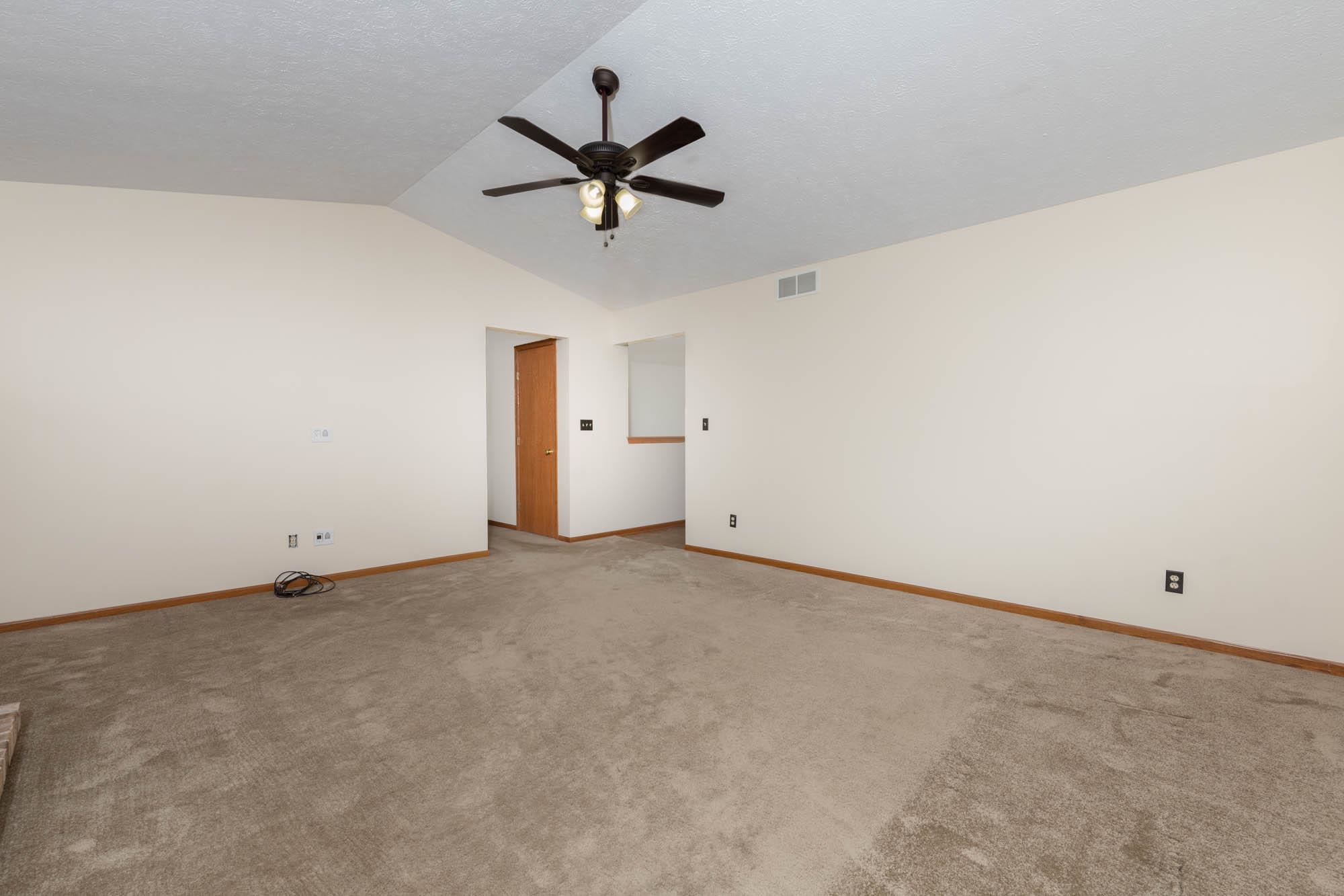 10686 Meadowsweet Lane Roscoe, IL 61073 - Photo 10 of 33 a view of a big room with carpet