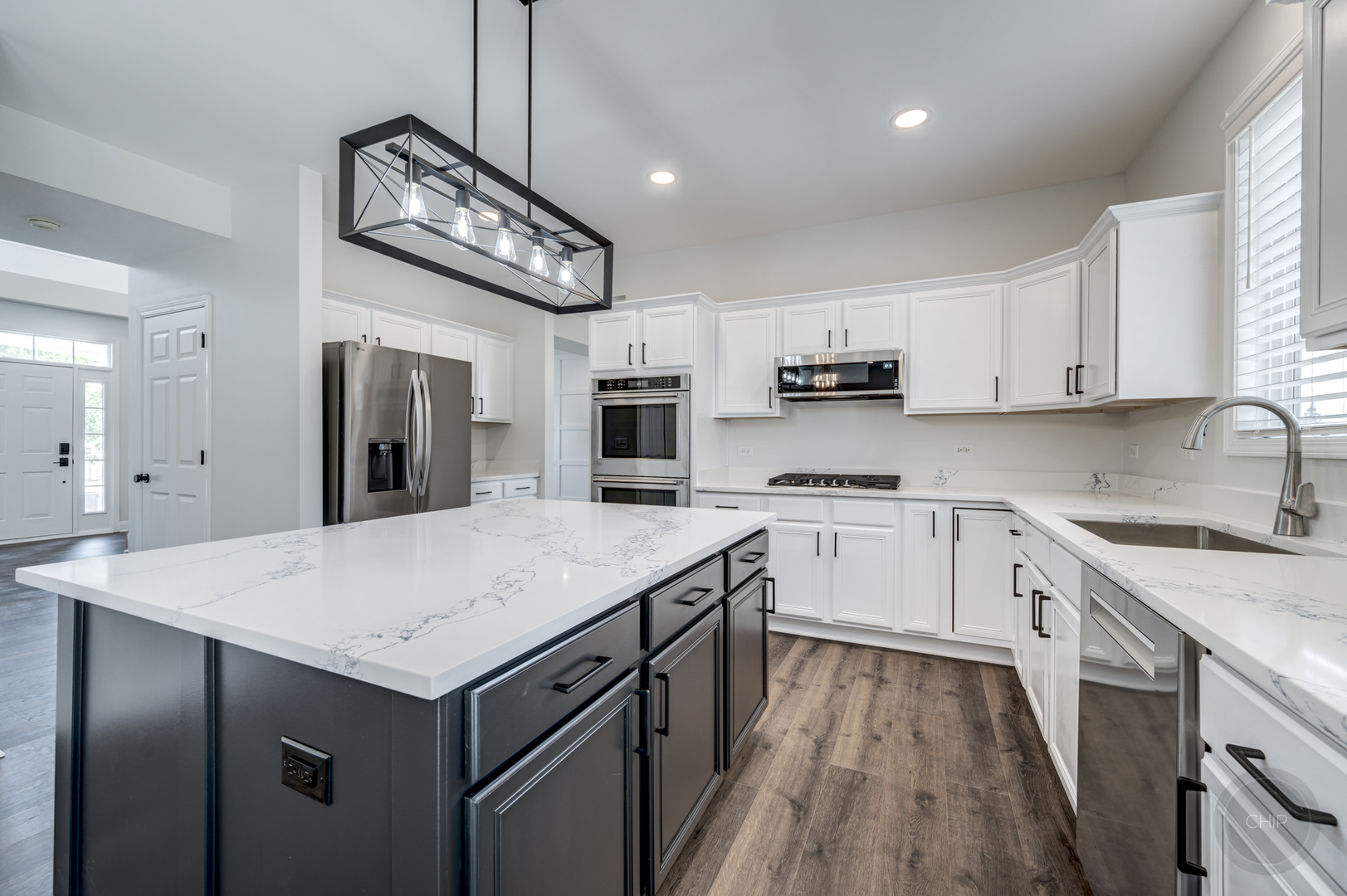 12948 Parterre Place Plainfield, IL 60585 - Photo 14 of 35 a kitchen with a sink stove and microwave