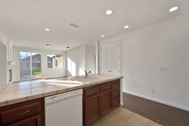 a kitchen with a sink and a window