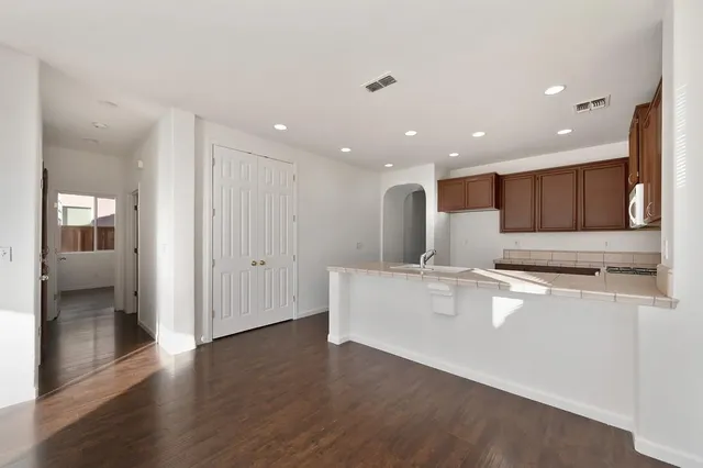 a view of kitchen with wooden floor