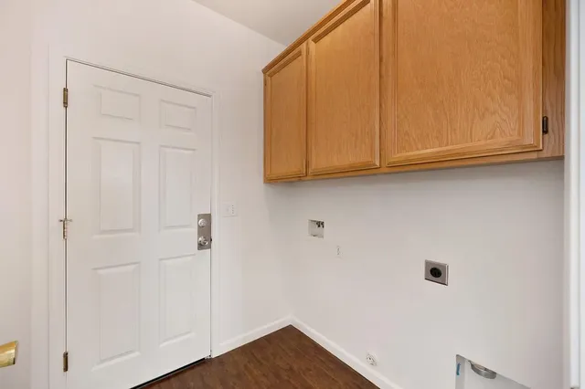 a view of storage and utility room with closet