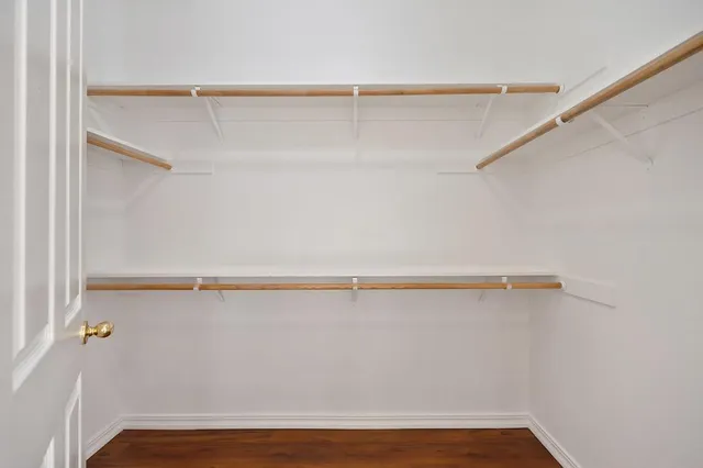 a view of an empty walk in closet
