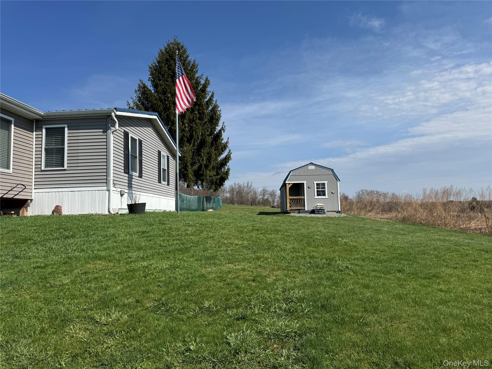 42 Fittkau Road Swan Lake, NY 12783 - Photo 24 of 36 a front view of a house with a garden