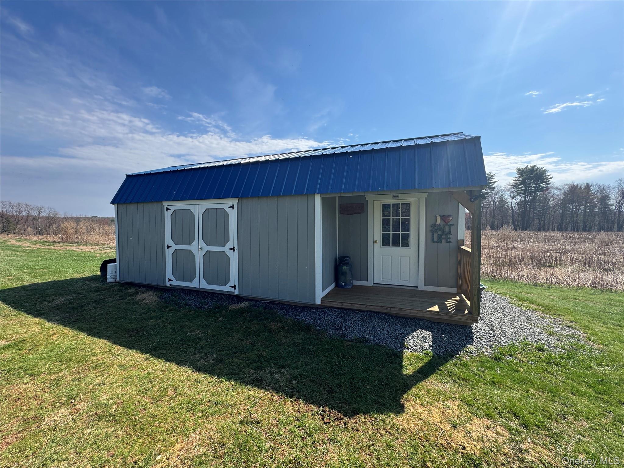 42 Fittkau Road Swan Lake, NY 12783 - Photo 27 of 36 a view of a house with backyard and garden