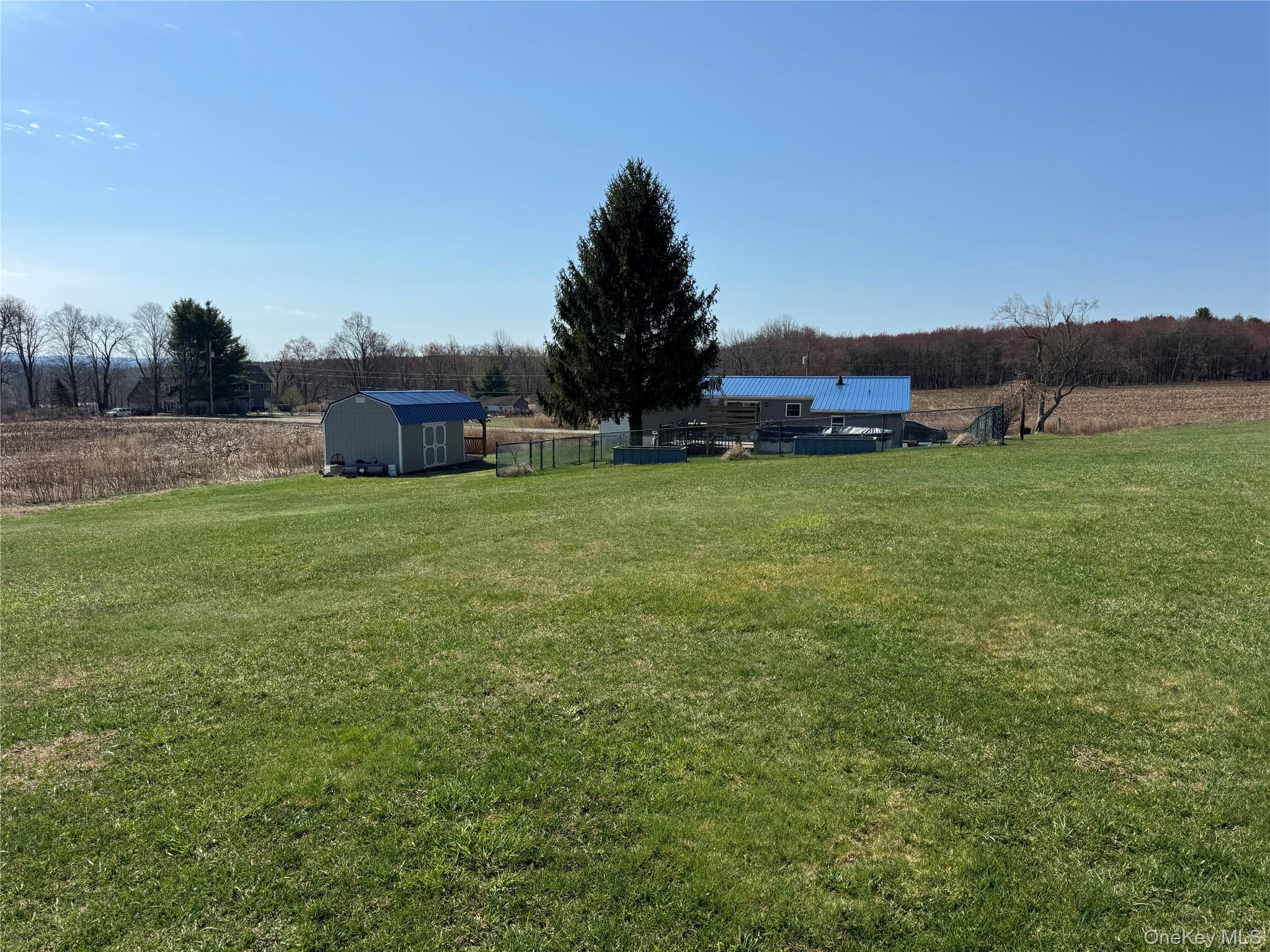 42 Fittkau Road Swan Lake, NY 12783 - Photo 29 of 36 a backyard of a house with table and chairs