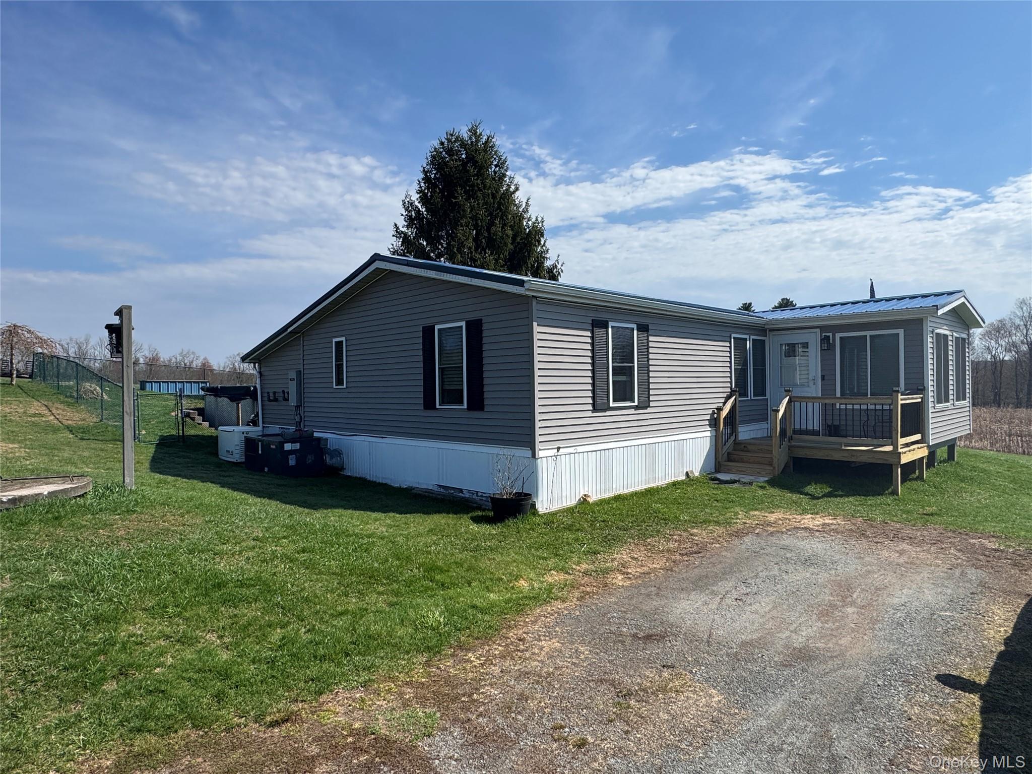 42 Fittkau Road Swan Lake, NY 12783 - Photo 3 of 36 a front view of a house with garden