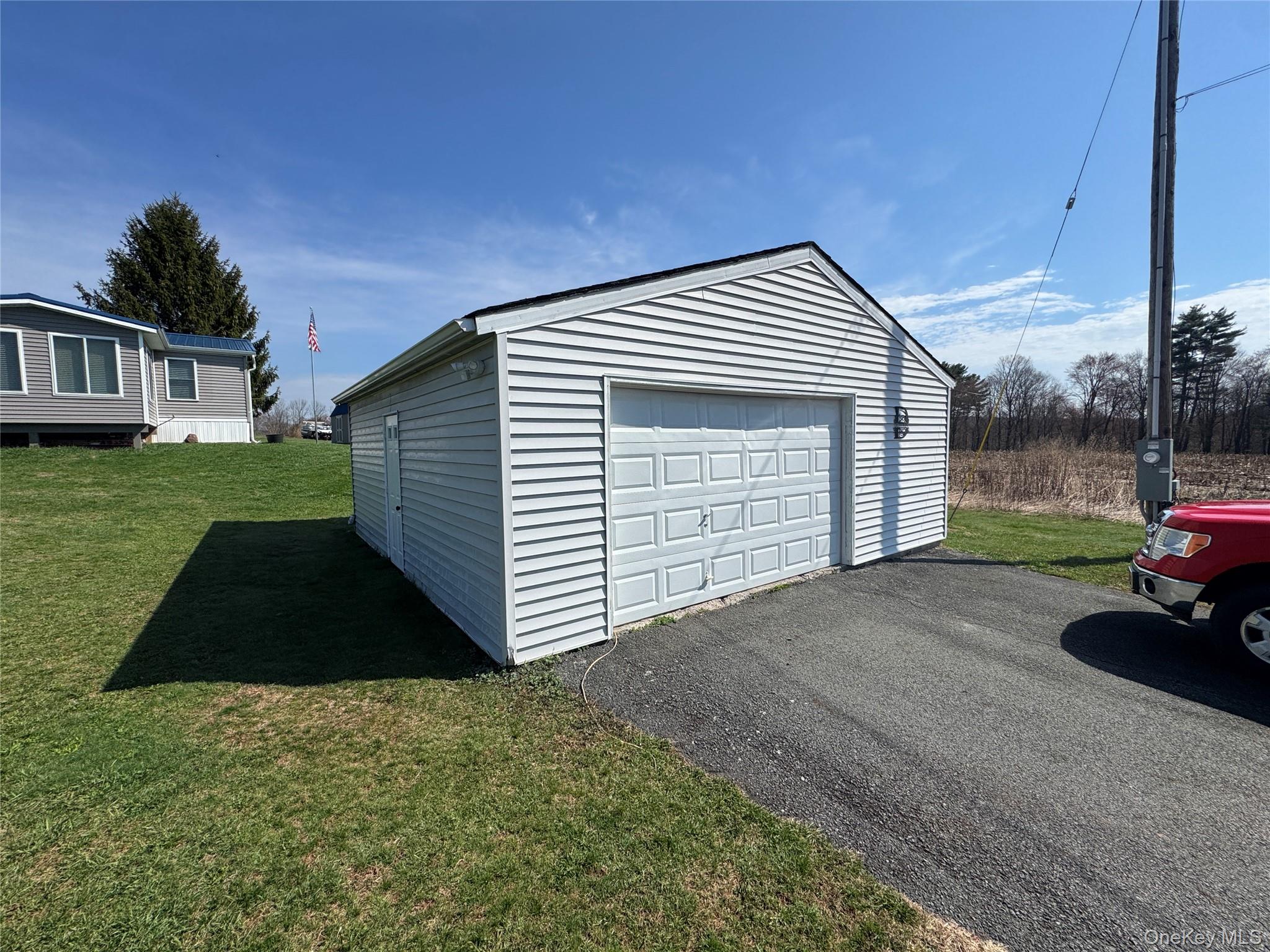 42 Fittkau Road Swan Lake, NY 12783 - Photo 31 of 36 a view of backyard of house and car parked